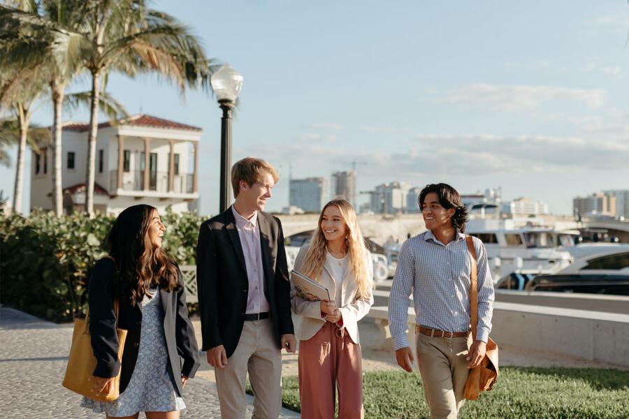 master of business administration mba students walk near the intercoastal waterway in 西<a href='http://i.shanemichaelmurray.com/'>推荐全球最大网赌正规平台欢迎您</a>.